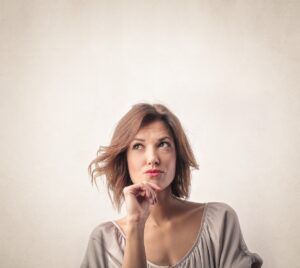 Woman in Johnson City places her hand on her chin and ponders the right age to start Botox